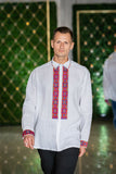 Men's white linen traditional shirt with a colorful embroidery