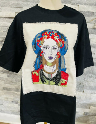 Black oversized T-shirt with a unique embroidered patch featuring a modern Ukrainian-inspired portrait. Stylish, bold, and perfect for making a statement.