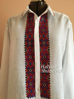 Men's white linen traditional shirt with a colorful embroidery