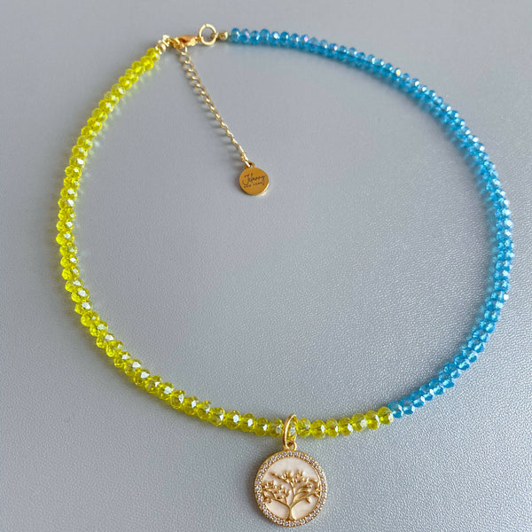 Blue and yellow necklace with tree pendant