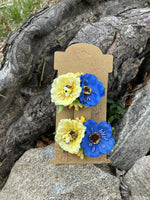 Hair clips in blue and yellow.