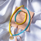 Set of blue and yellow jewelry with Life tree and heart