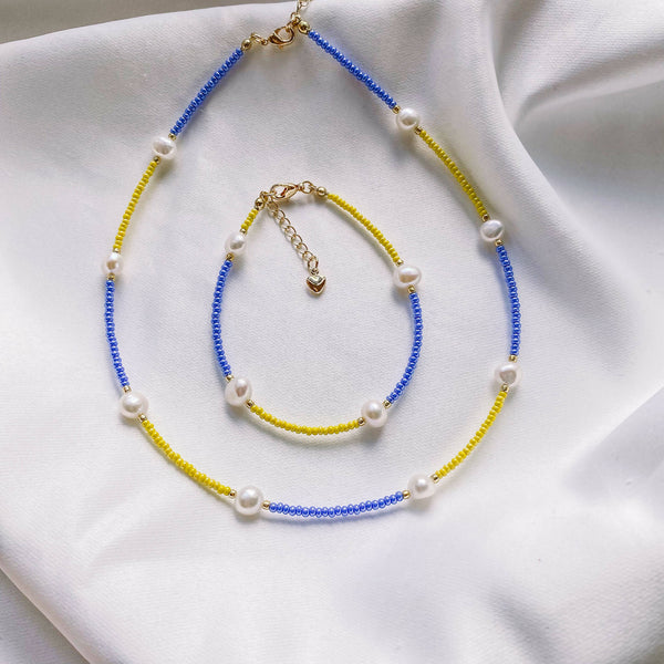 Set of blue and yellow jewelry with pearls