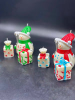 Snowman's and gift boxes shape candles