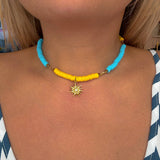 Blue & yellow choker with sun pendant